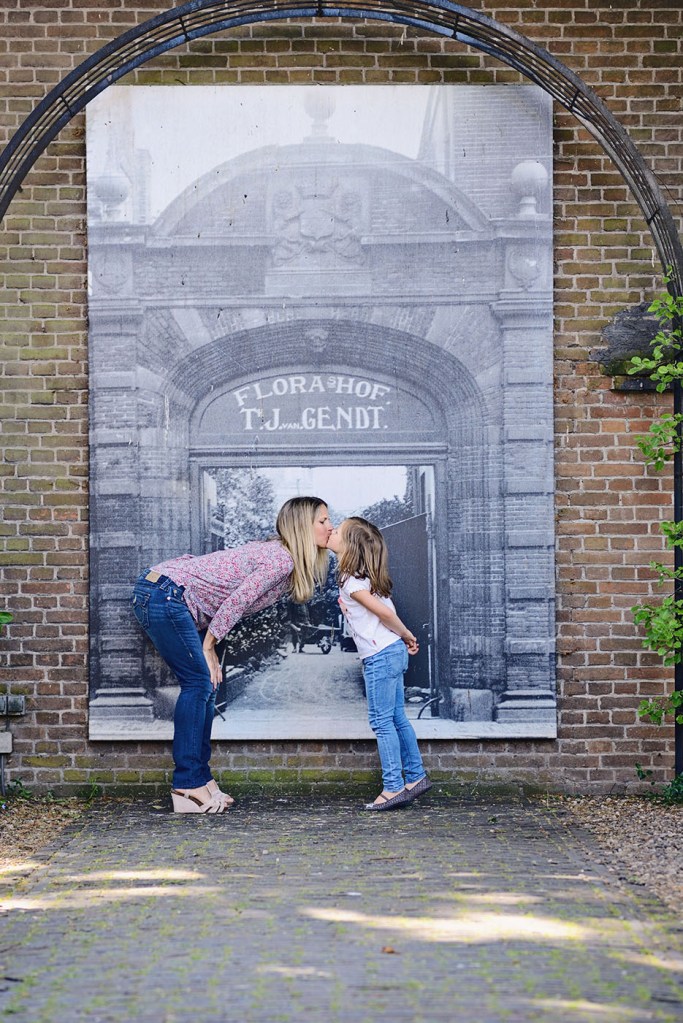 Mom and daughter kiss